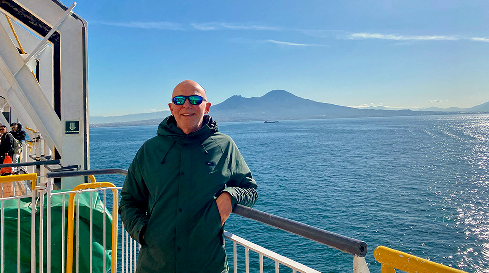 Paul Miles standing on the sun deck of a ferry